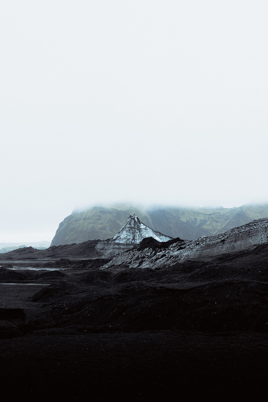 Impressive ice formations on Katla glacier, with jagged peaks and smooth, icy surfaces reflecting the light.