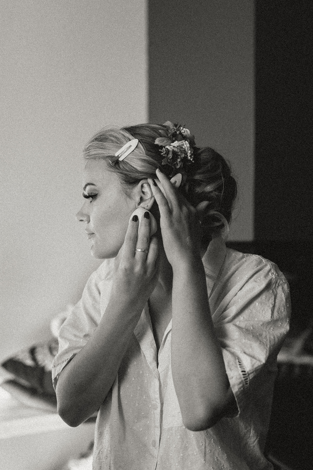 Bride applying her makeup at Eirð Retreat, capturing the intimate moments of preparation before her Icelandic elopement.