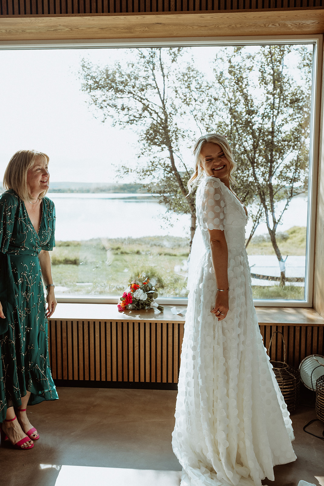 Bride’s mother seeing her daughter in her wedding dress for the first time, an emotional moment before the Icelandic elopement.