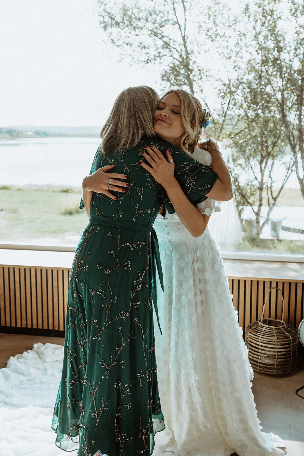 Bride's mother reacting with joy as she sees her daughter in her stunning wedding dress, capturing the emotional moment at Eirð Retreat
