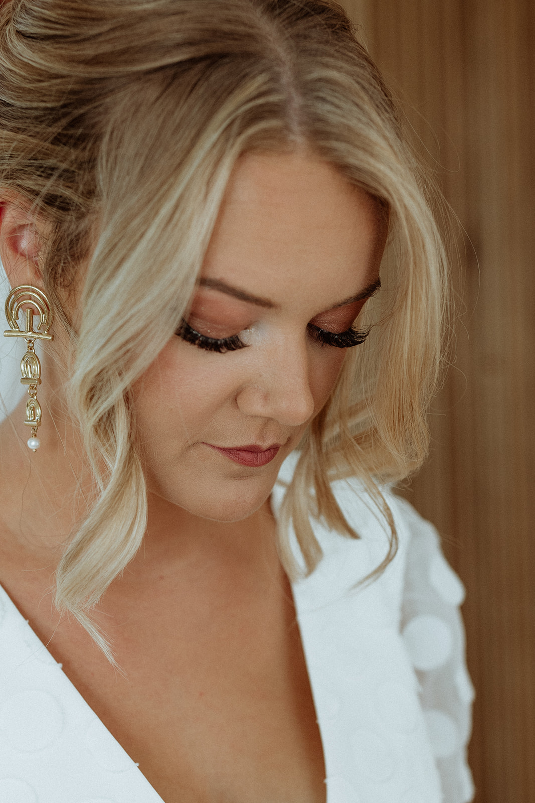 Close-up bridal portrait of the bride, showcasing her radiant expression and delicate wedding dress details during her Icelandic elopement.