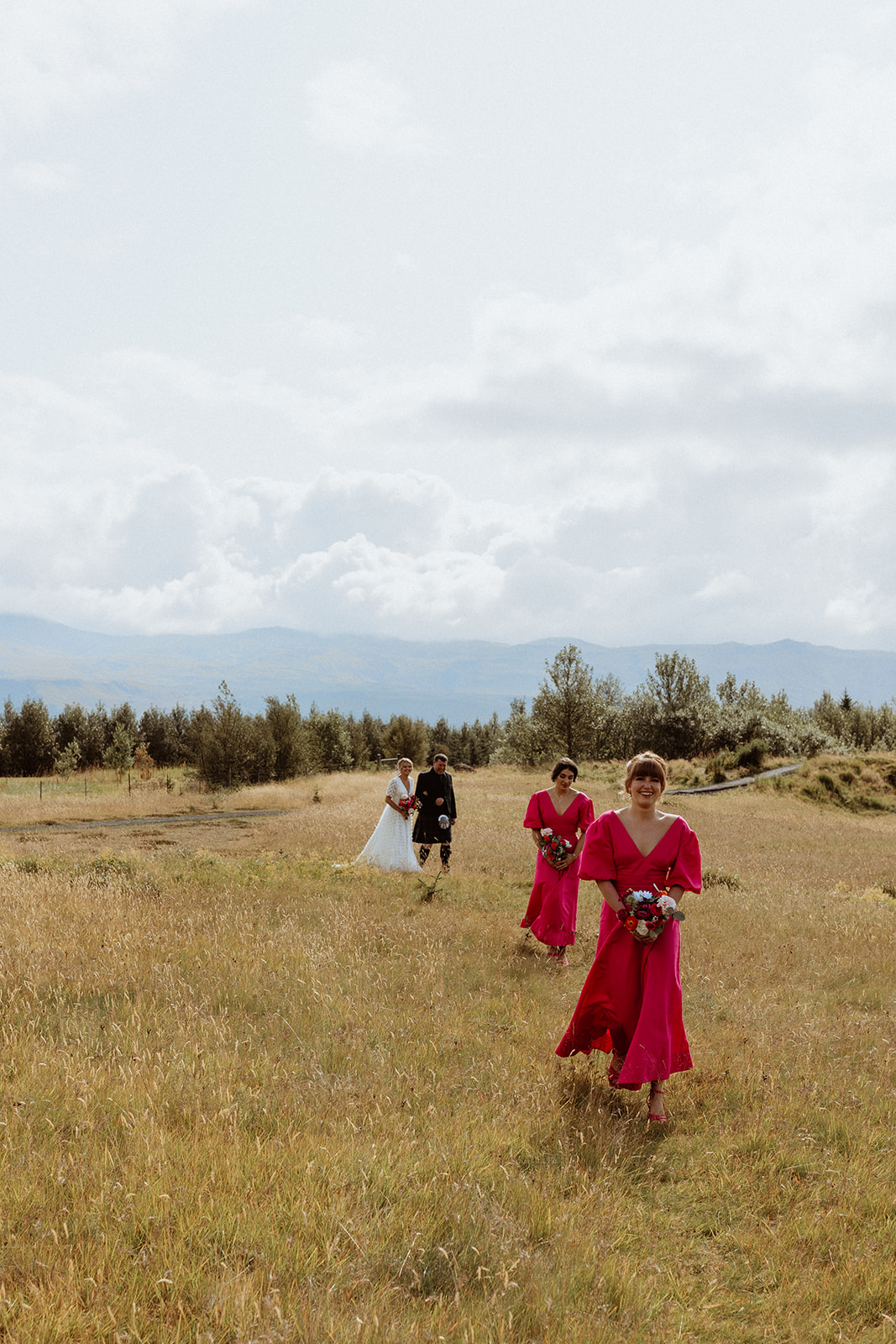 Wedding party arriving at the ceremony location near Gluggafoss waterfall in Iceland, ready to witness the couple's intimate elopement