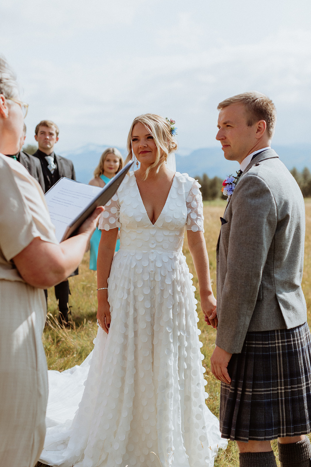 Bride and groom during their elopement ceremony at Gluggafoss waterfall, surrounded by Iceland's stunning landscapes.