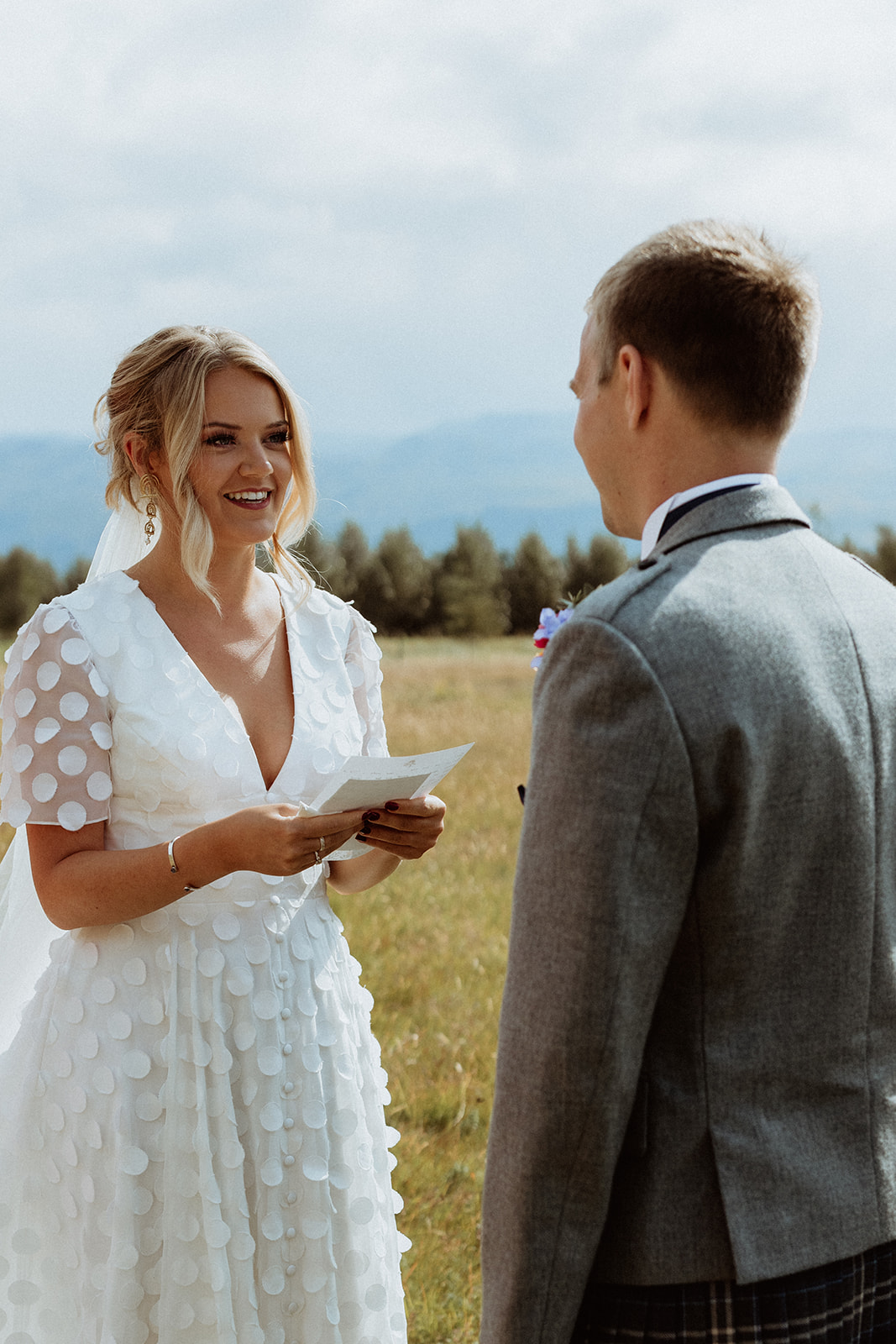 Bride and groom sharing personal vows during their intimate elopement ceremony at Gluggafoss waterfall in Iceland