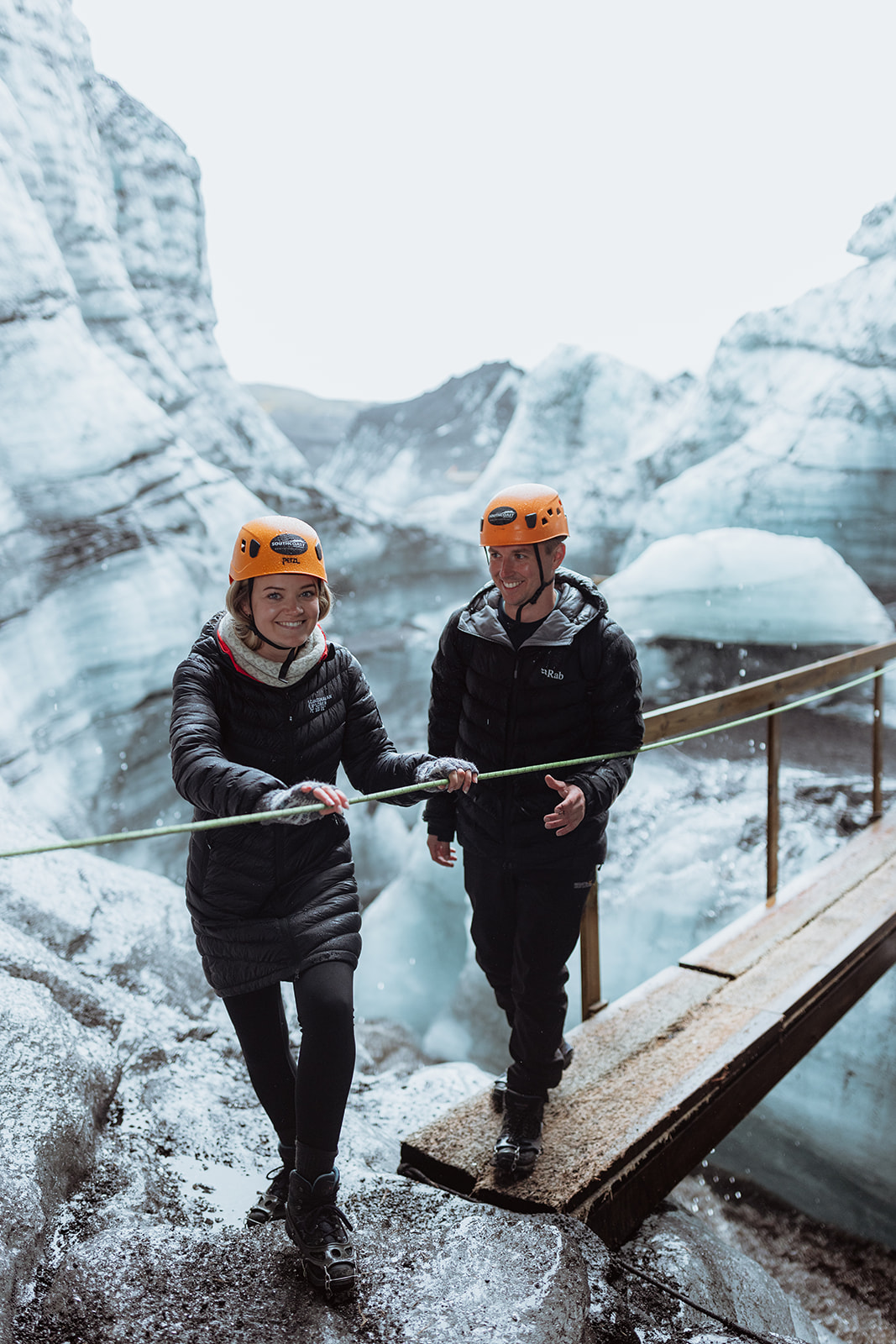 Amy and Tom walk across the vast expanse of Katla glacier, with the rugged, icy landscape stretching out ahead.