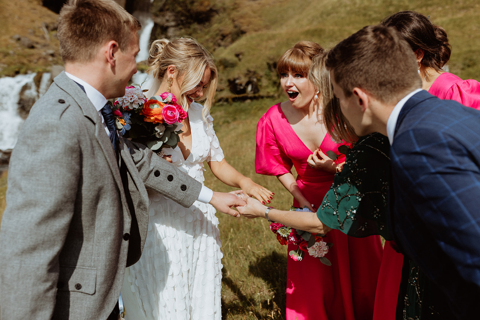 Bride admiring the unique rings she crafted herself, with a soft focus on the intricate details during their Iceland elopement.