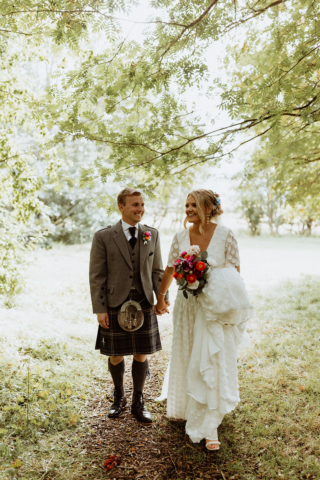 Bride and groom arriving at the serene Thornsteins Grove for a private picnic during their Iceland elopement, surrounded by nature.