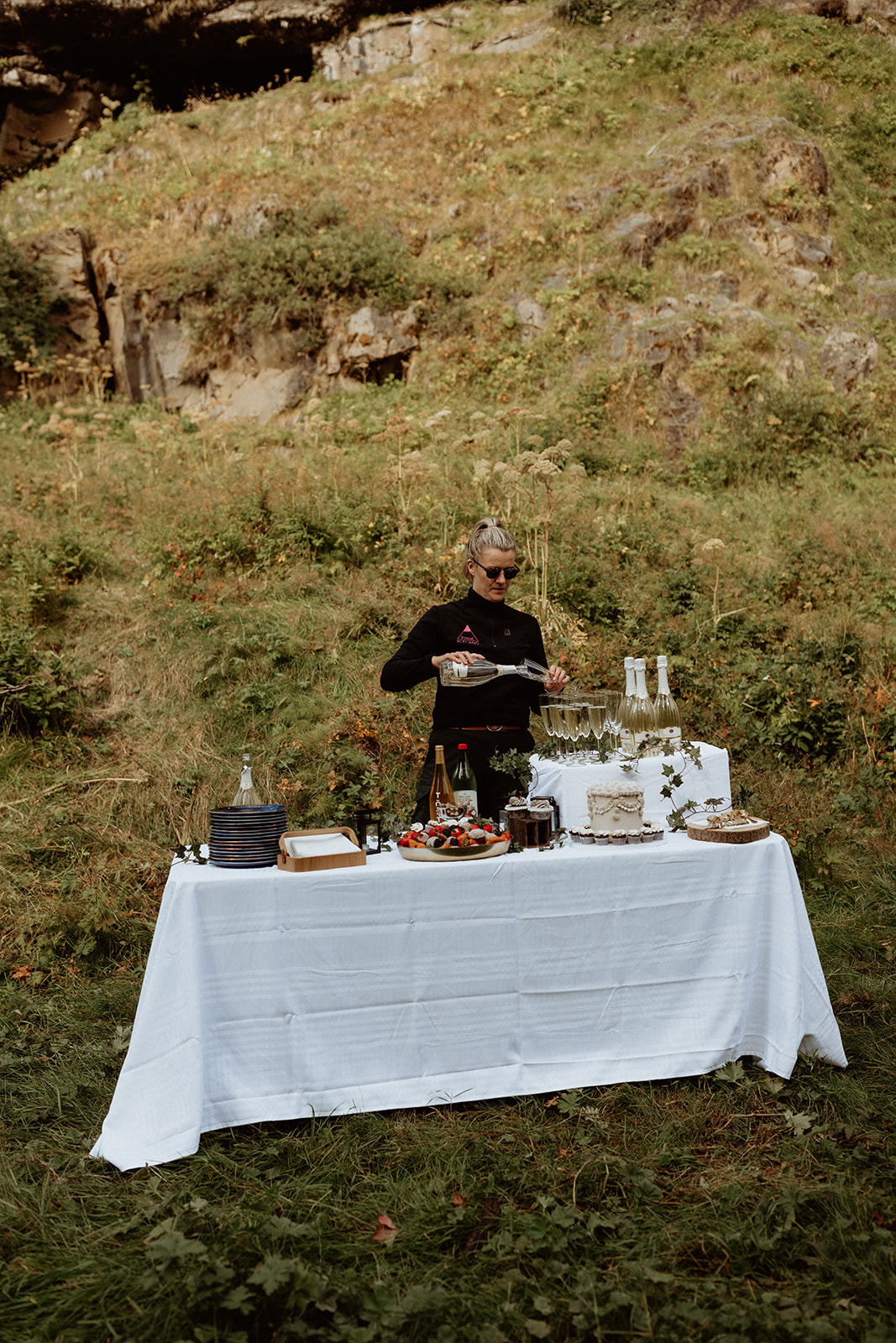 Bride and groom enjoying a romantic, private picnic arranged by Pink Iceland at Thornsteins Grove during their Iceland elopement.
