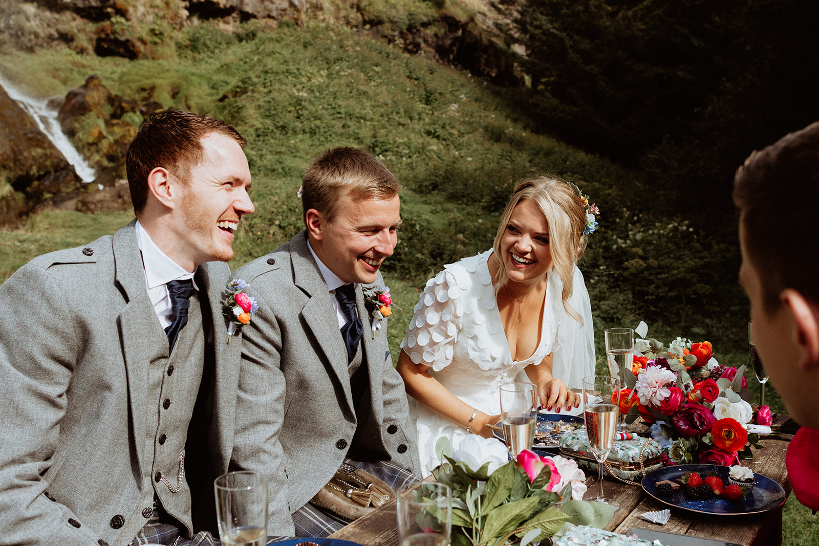 Groomsmen laughing and enjoying the moment during the Iceland elopement celebration at Thornsteins Grove.