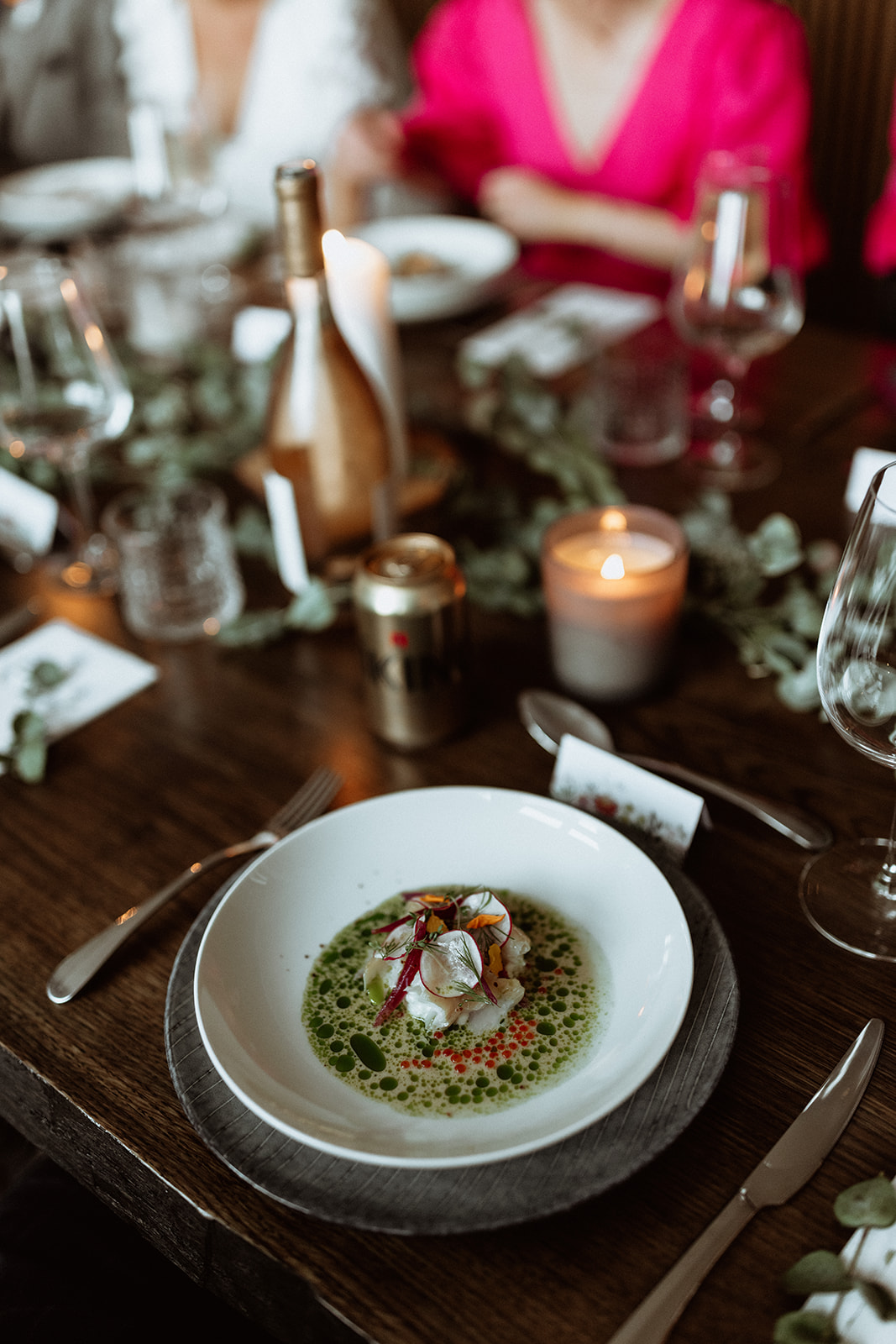 Close-up of a beautifully plated fine dining dish at the Icelandic elopement reception, showcasing exquisite culinary presentation
