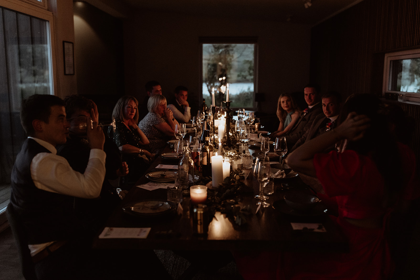 Guests enjoy the lively and cheerful atmosphere, laughter filling the air as the newlyweds soak in the magic of their Icelandic adventure elopement.