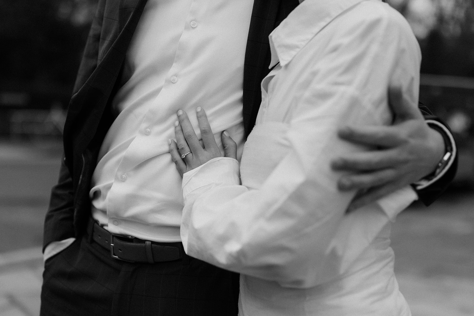 Couple enjoying a relaxed editorial-style engagement session as they stroll through Edinburgh’s streets.