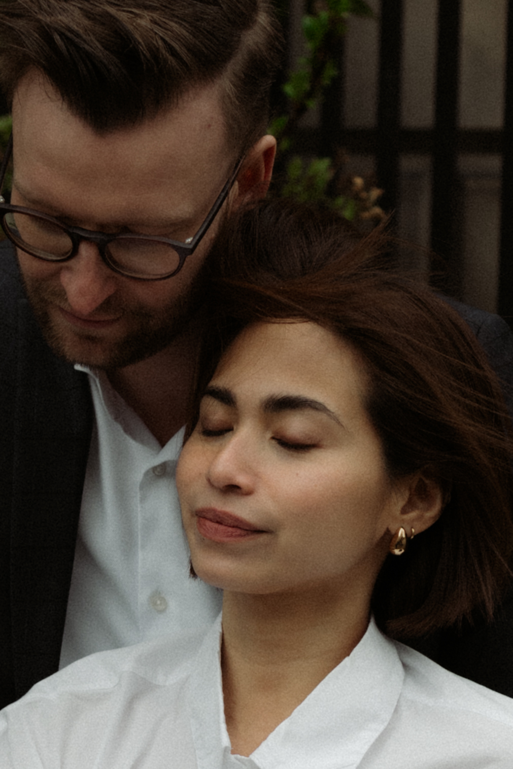 Romantic editorial engagement session with a couple walking hand-in-hand through Edinburgh’s streets.