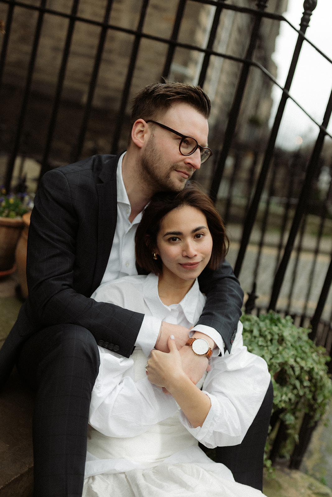 Candid editorial engagement session in Edinburgh with a couple strolling hand-in-hand through the city.