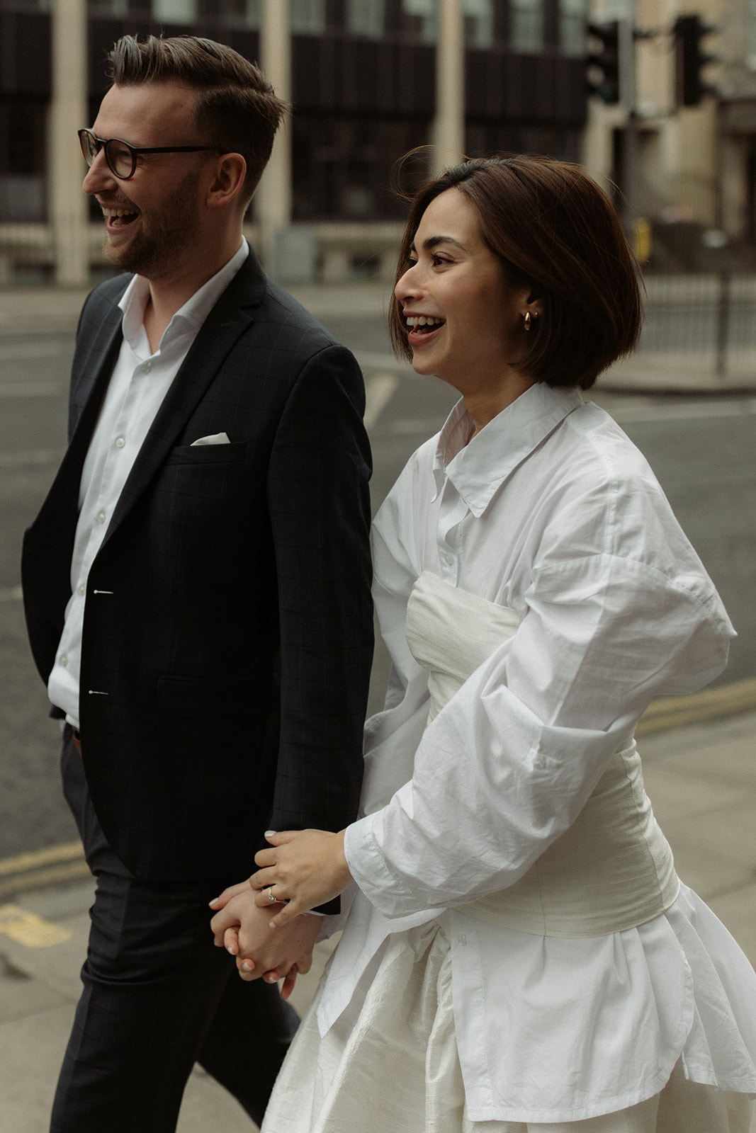 Effortless style engagement session in Edinburgh with the couple strolling through charming city streets.