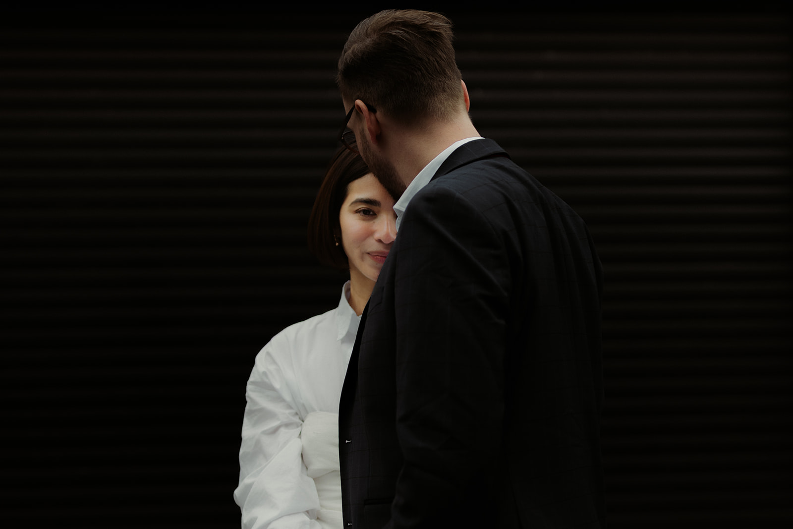 Captured editorial engagement photo of a couple enjoying a romantic walk through Edinburgh’s streets.