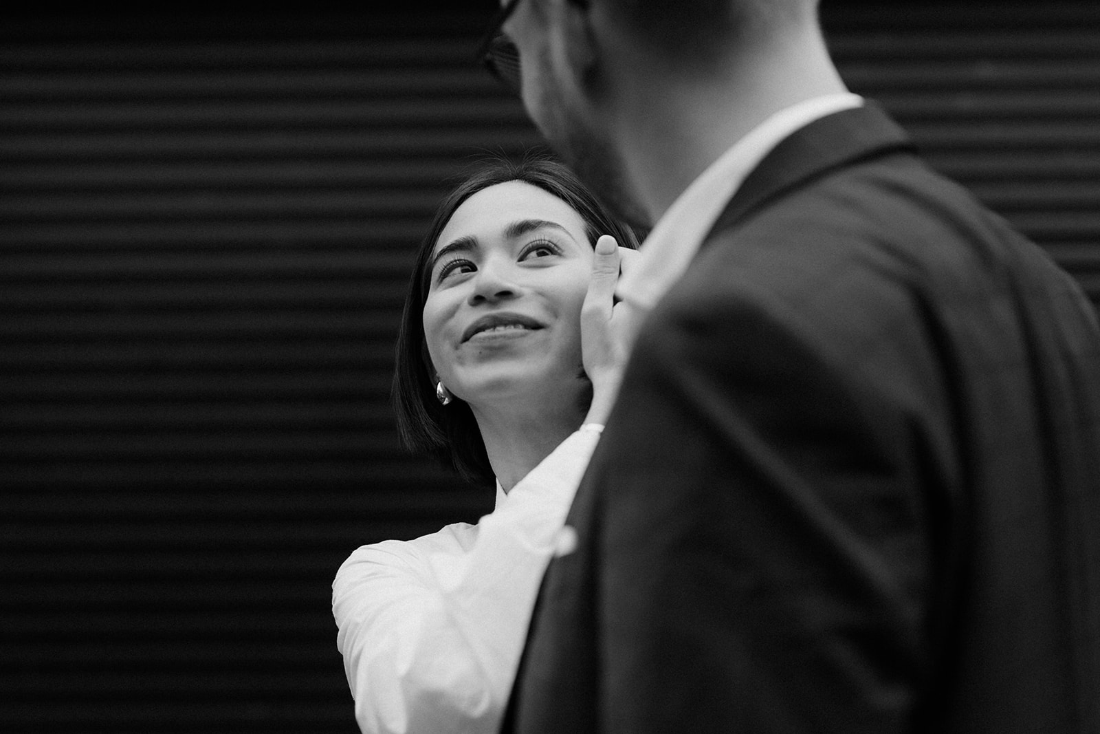 Editorial and documentary-style engagement session, showing a couple walking hand-in-hand through Edinburgh.