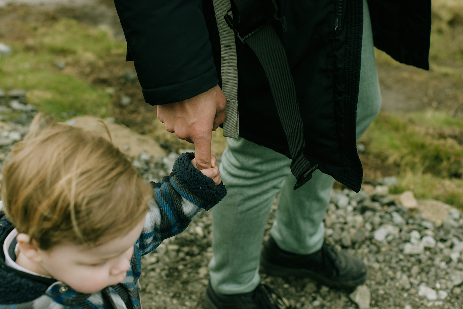 Toddler holding the groom’s hand during Isle of Skye elopement