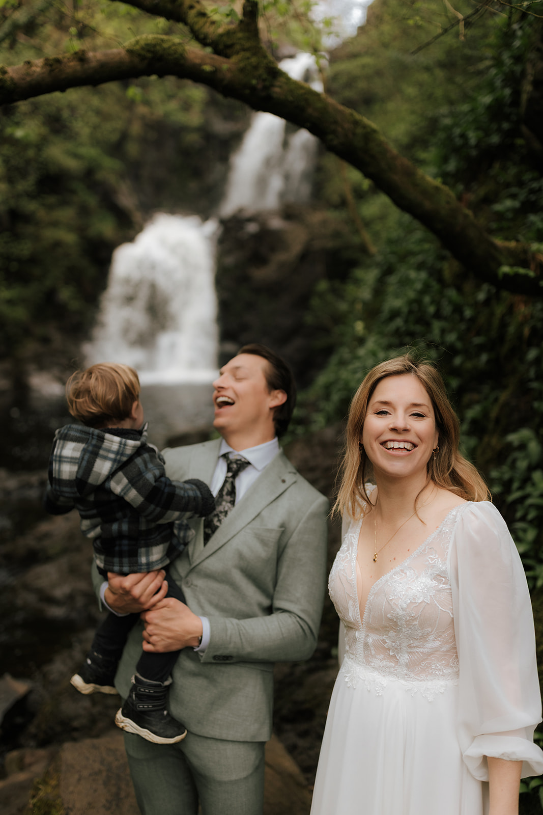 Family sharing a joyful laugh during their Isle of Skye elopement adventure