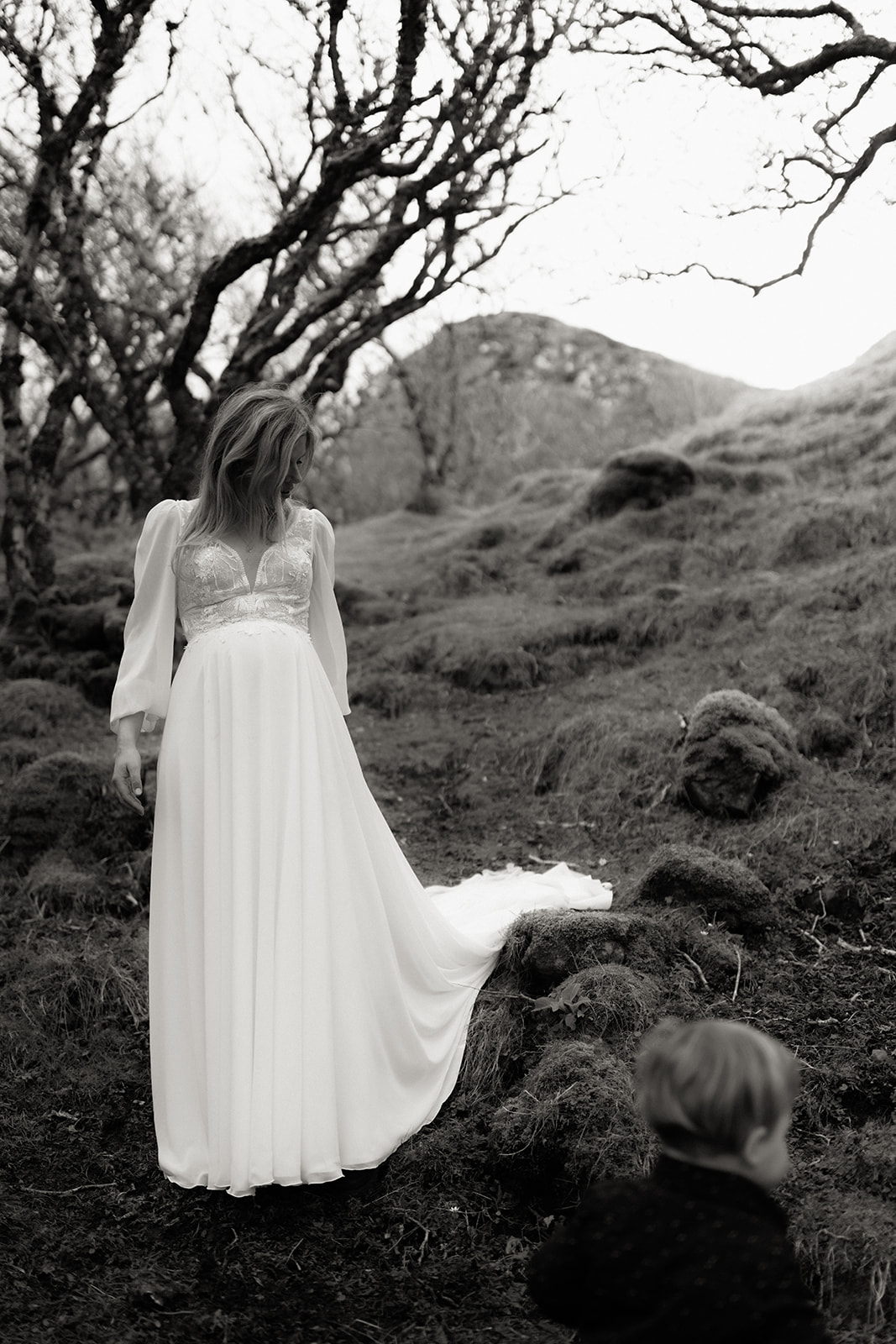 Whimsical bride enjoying a moment surrounded by nature on the Isle of Skye