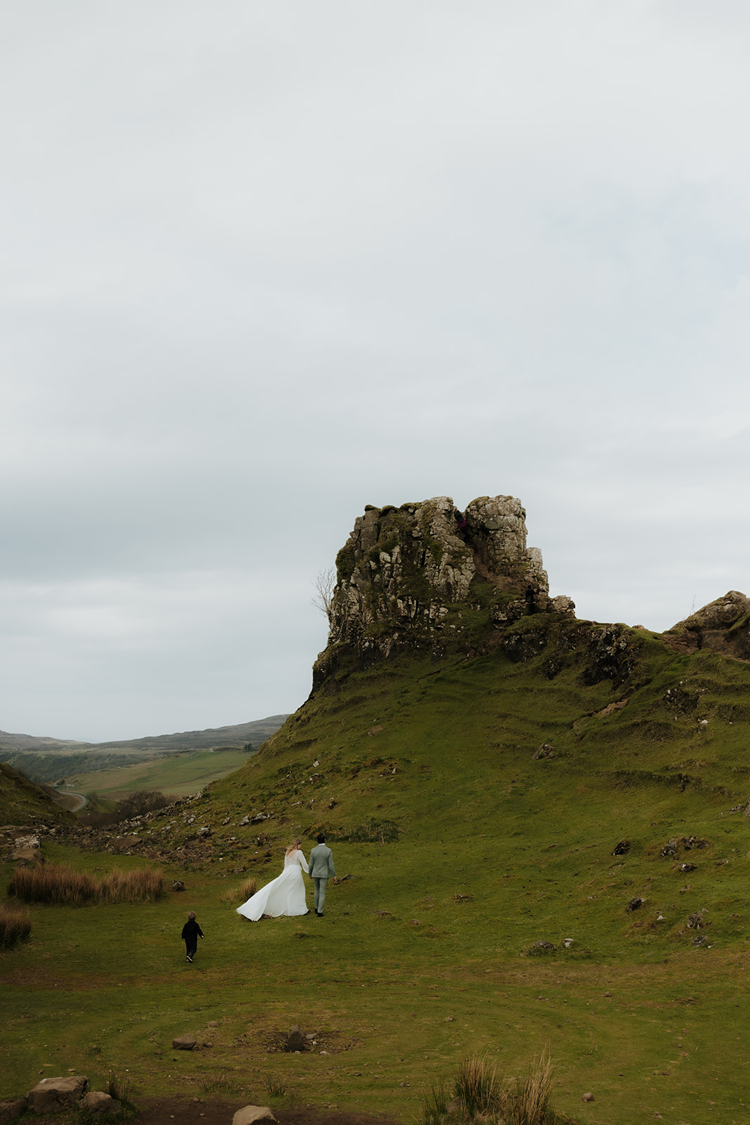 Wide shot capturing the rolling hills and unique landscape of the Fairy Glen on the Isle of Skye
