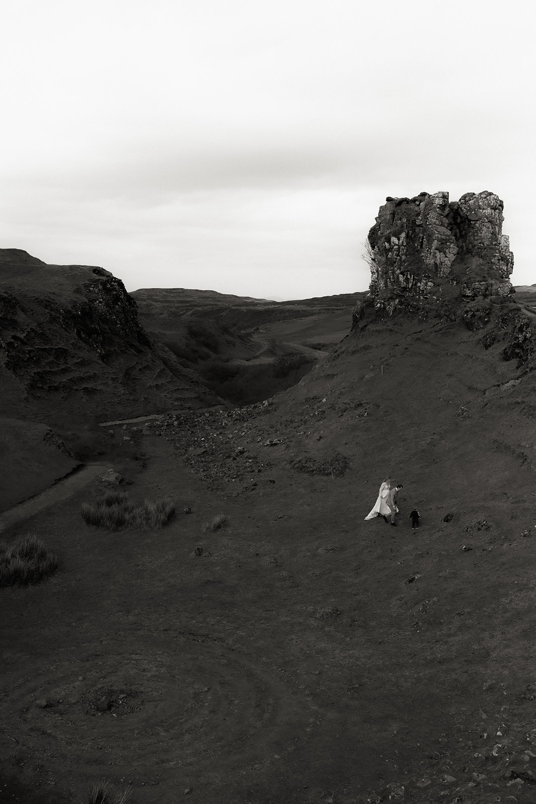 Expansive wide-angle view of the Fairy Glen with vibrant greenery and rocky formations on Skye