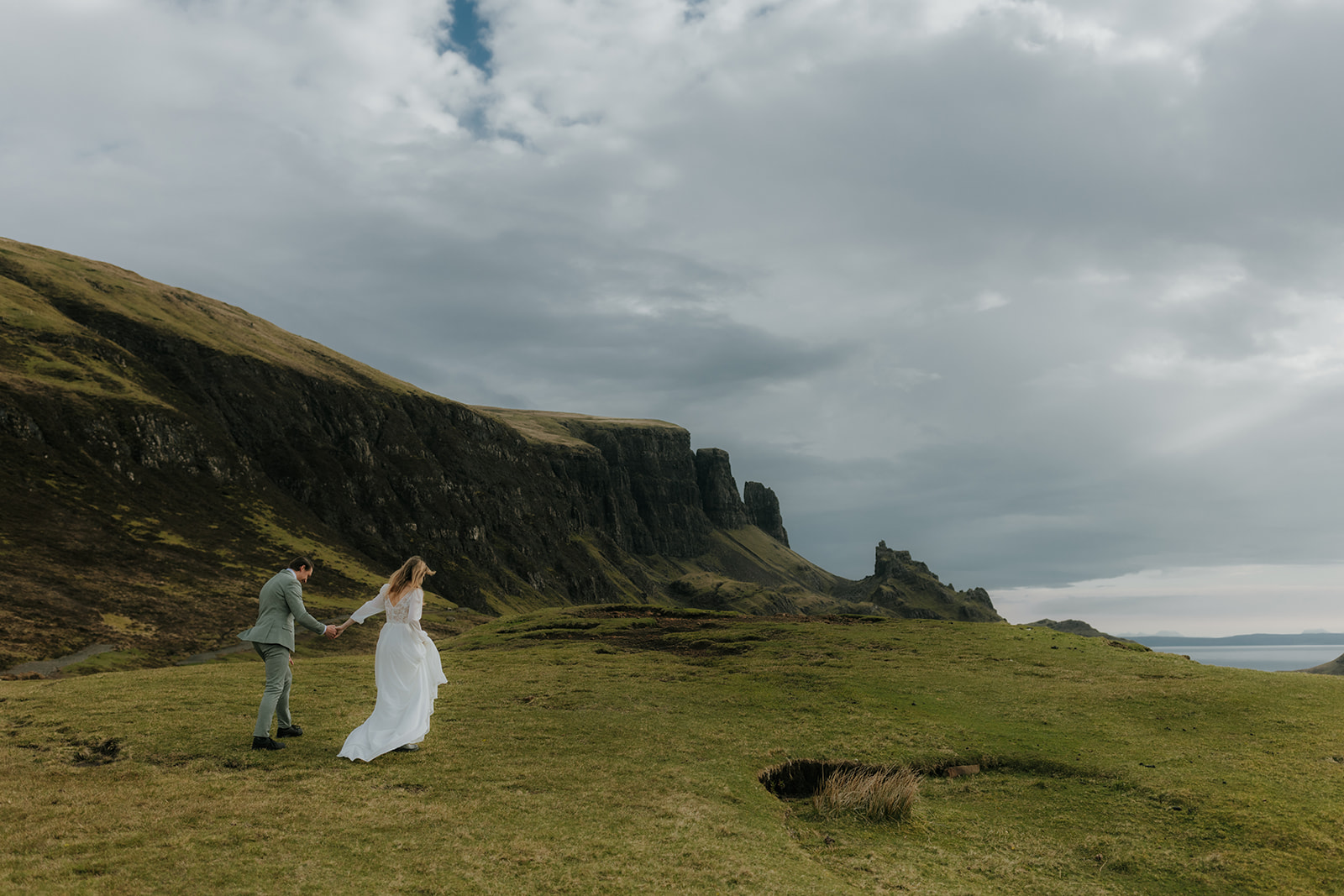 Couple laughing in the wind during Isle of Skye elopement