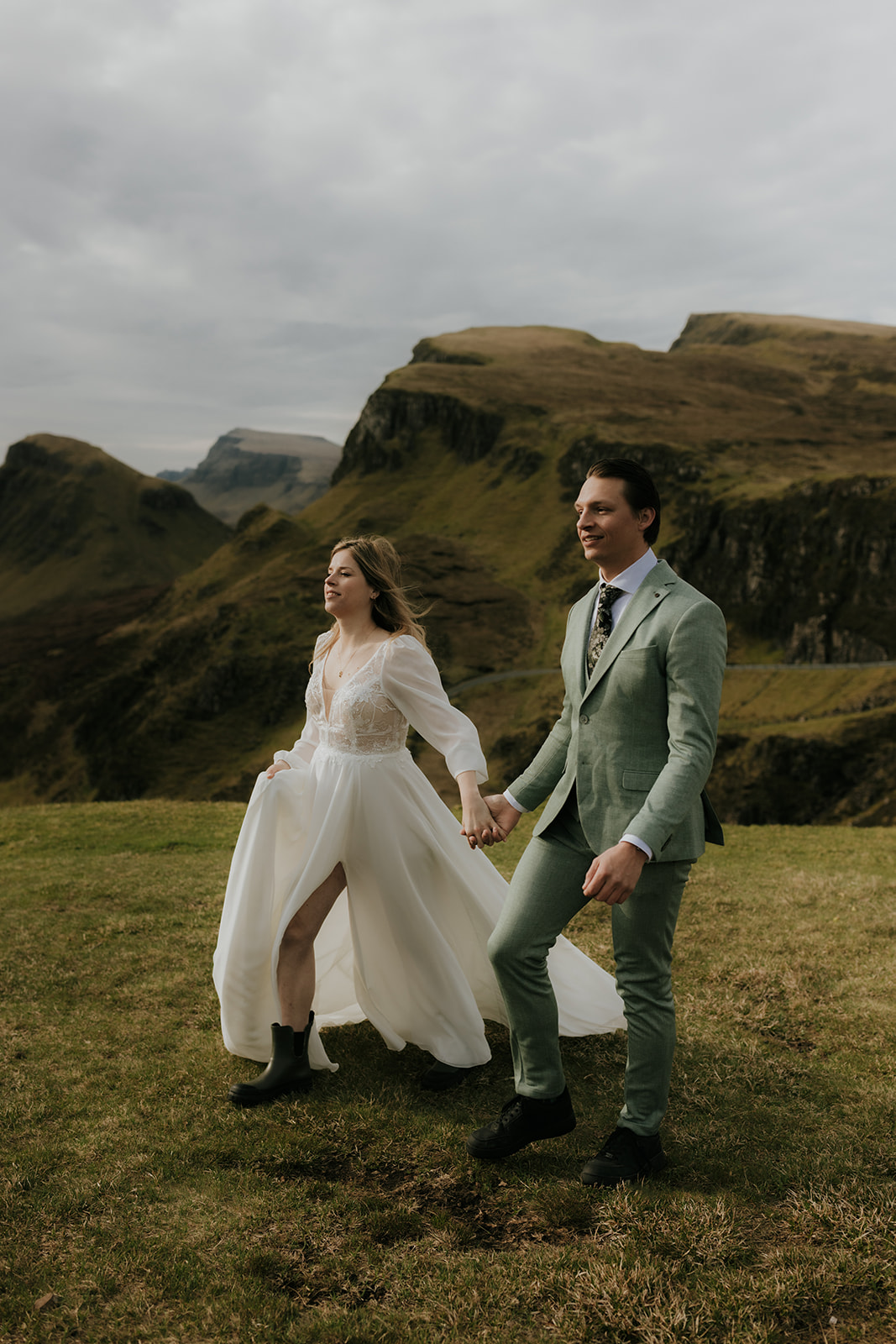 Hand in hand at the edge of the world — a peaceful moment before their vows.