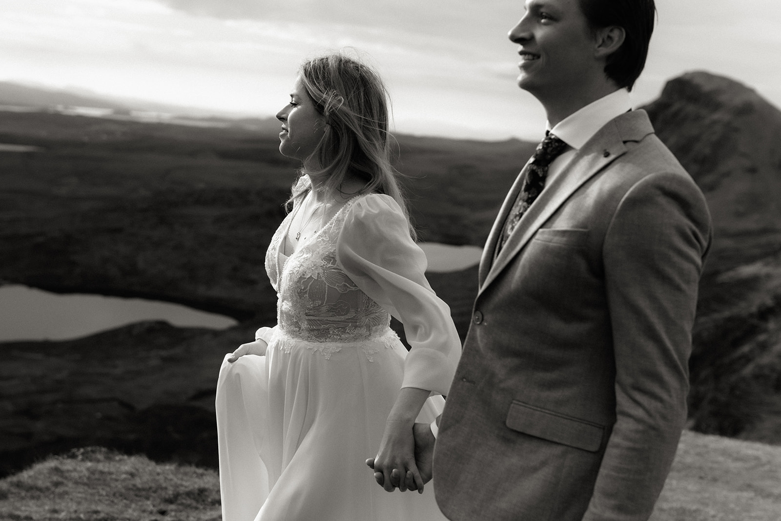 Eloping couple exploring the Isle of Skye landscape together