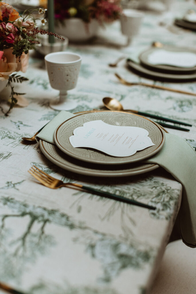 White place setting with elegant stationery and florals at Le Riad Yasmine Marrakesh