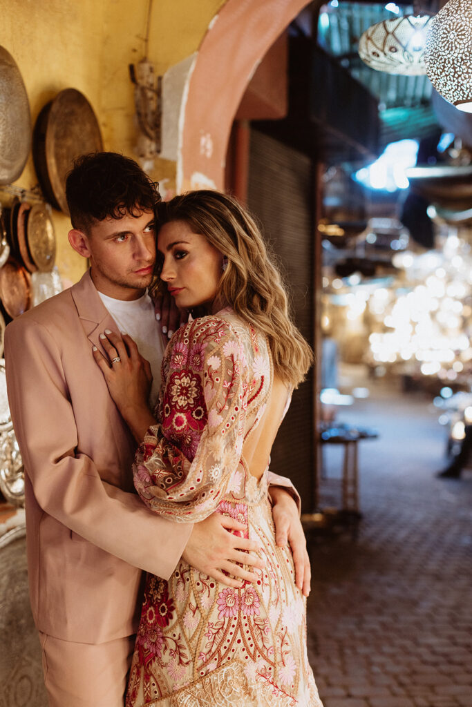 Bride and groom embracing in warm golden evening light in Marrakesh