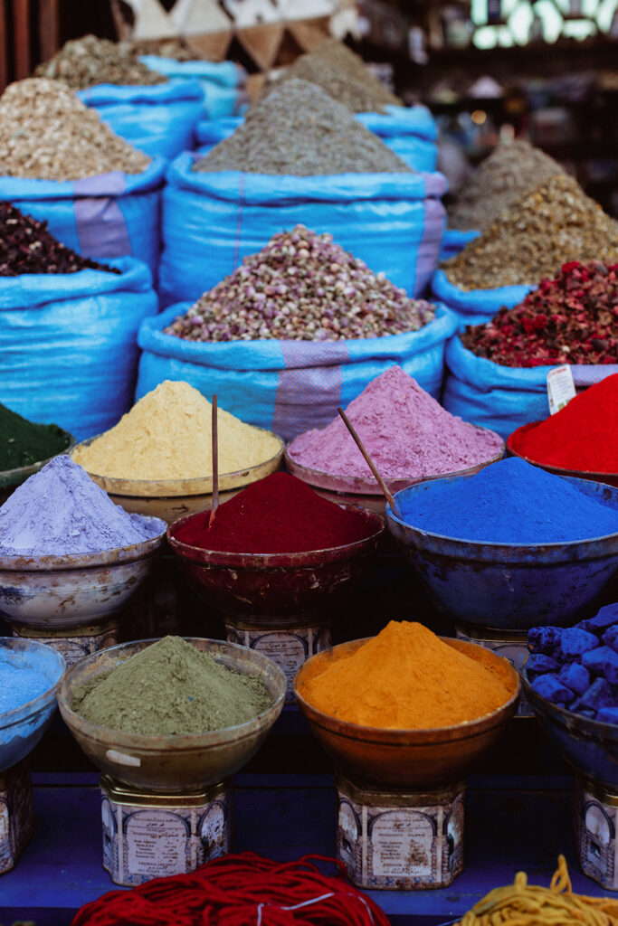 Pyramids of colourful spices at a Marrakesh market stall
