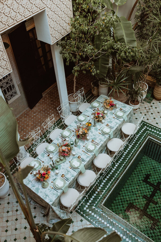 Elegant outdoor wedding table setting with florals at Le Riad Yasmine Marrakesh
