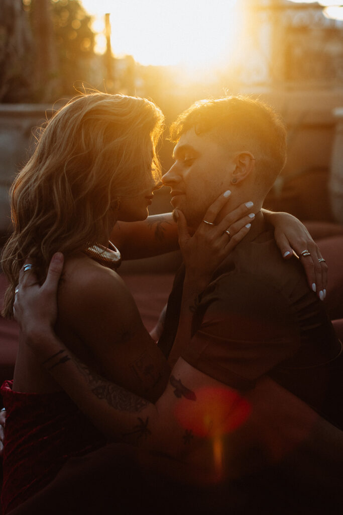 Couple embracing with sun flare in Marrakesh