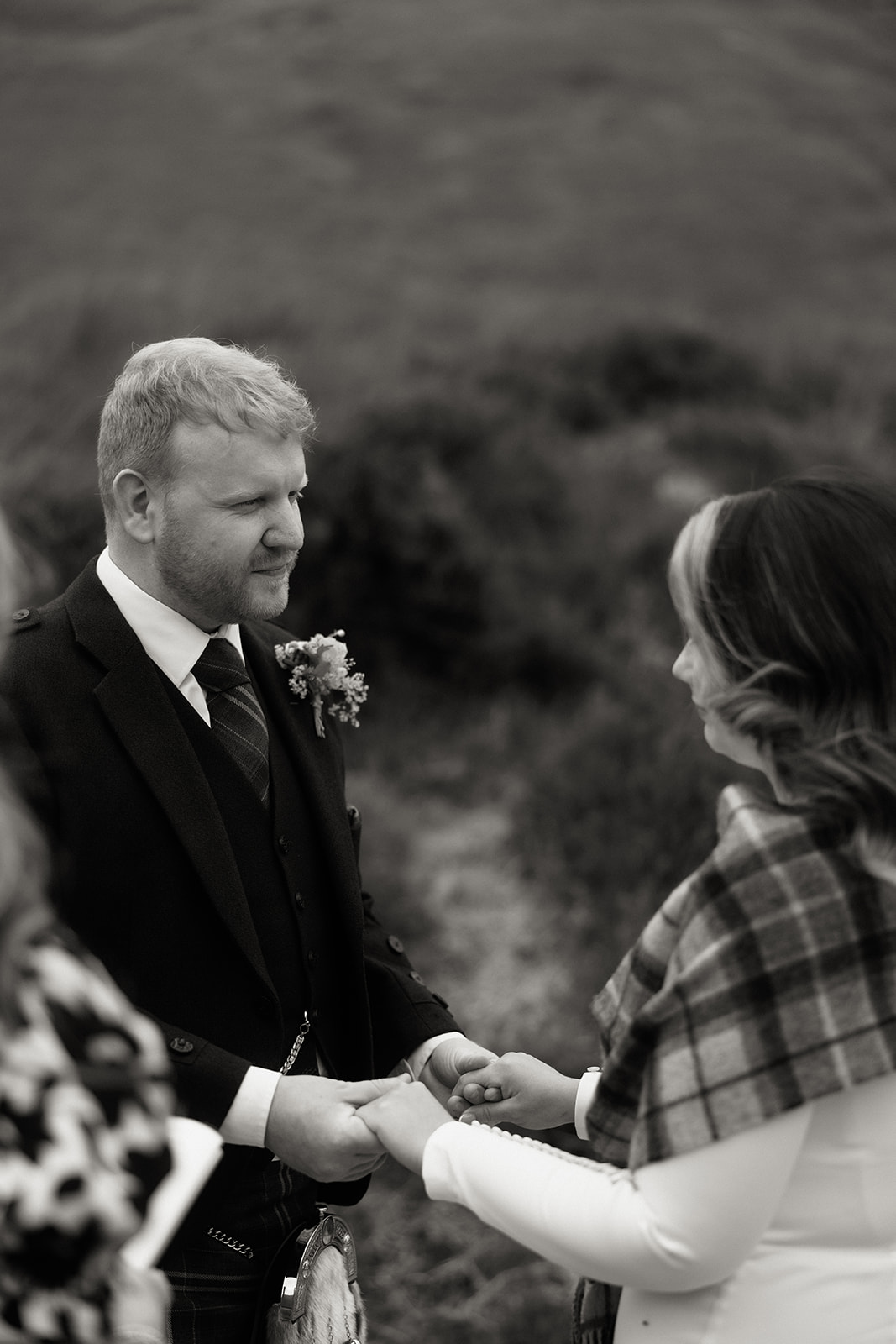 Black and white portrait of groom in kilt during Isle of Arran elopement ceremony.