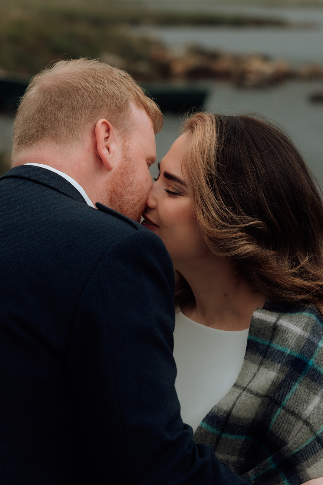 Bride and groom sharing their first kiss.