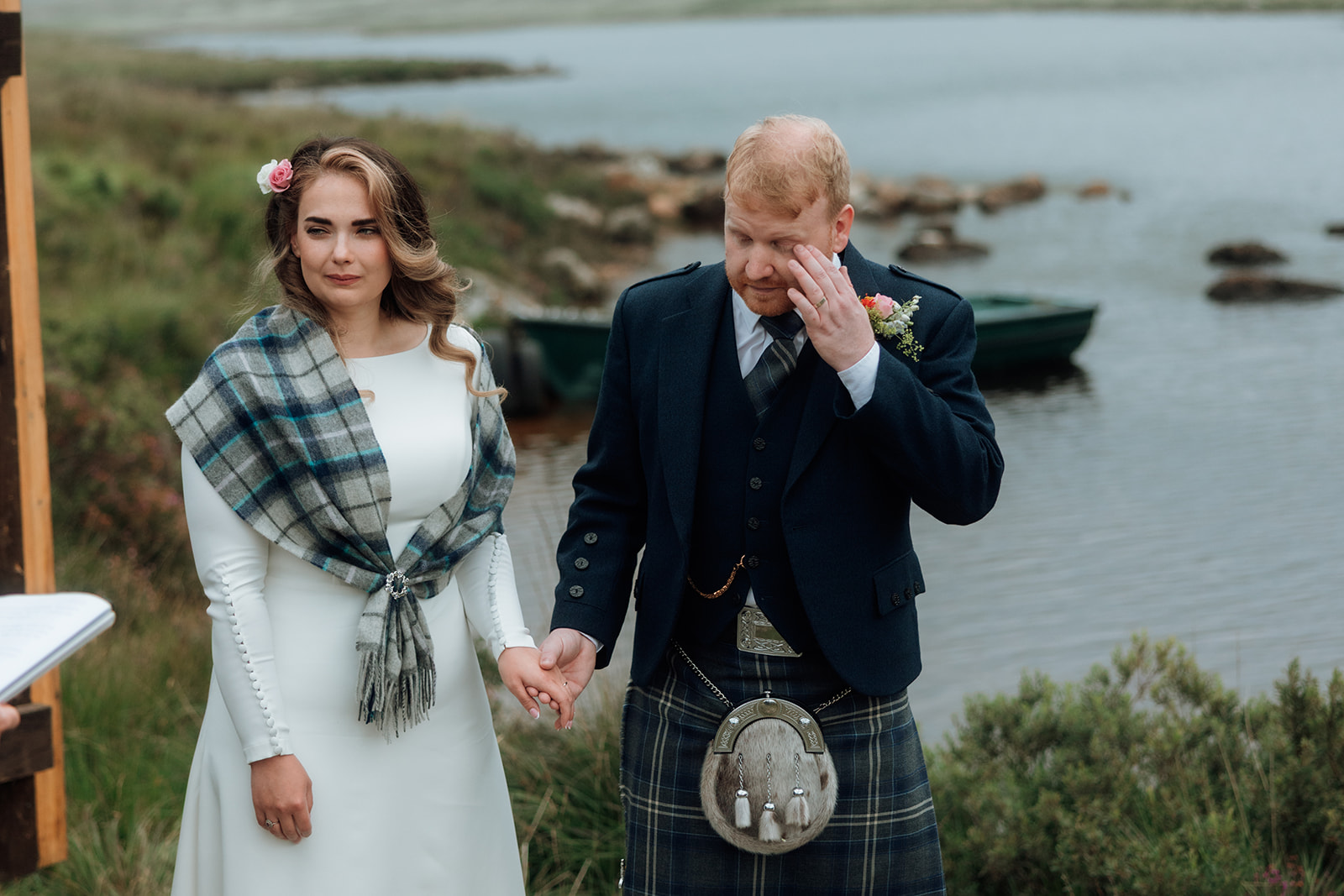 Groom wiping away tears after wedding ceremony at Loch Iorsa, Isle of Arran.