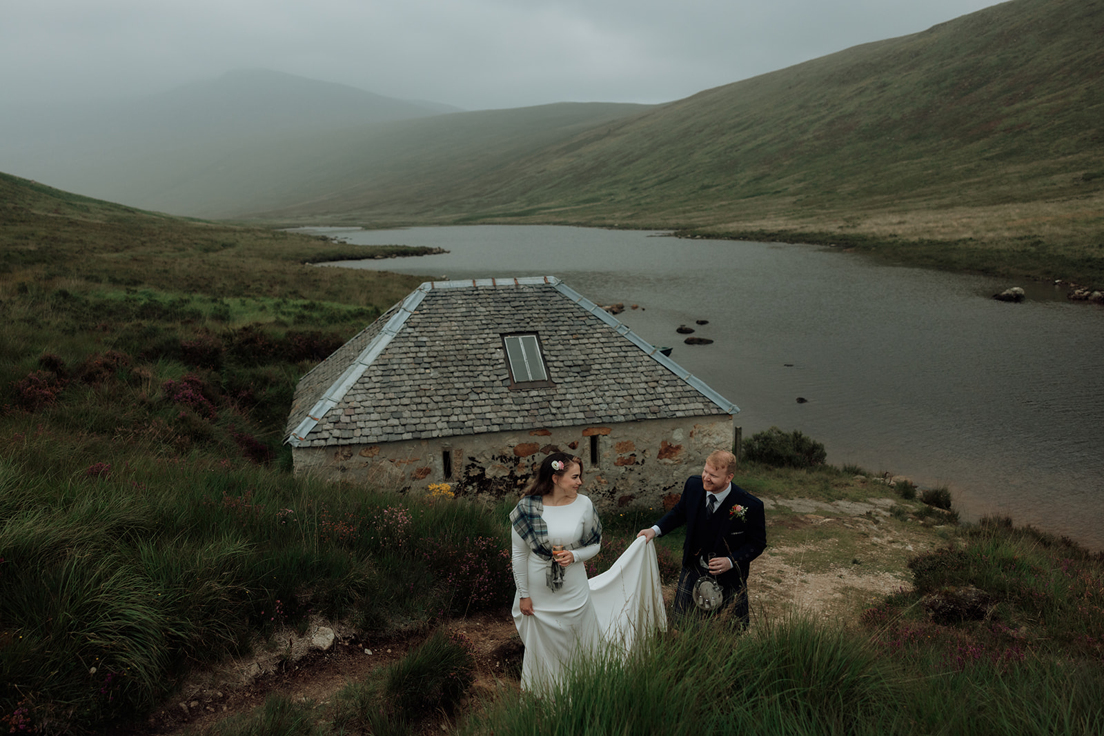 Dougarie Boathouse with misty hills behind on Isle of Arran.