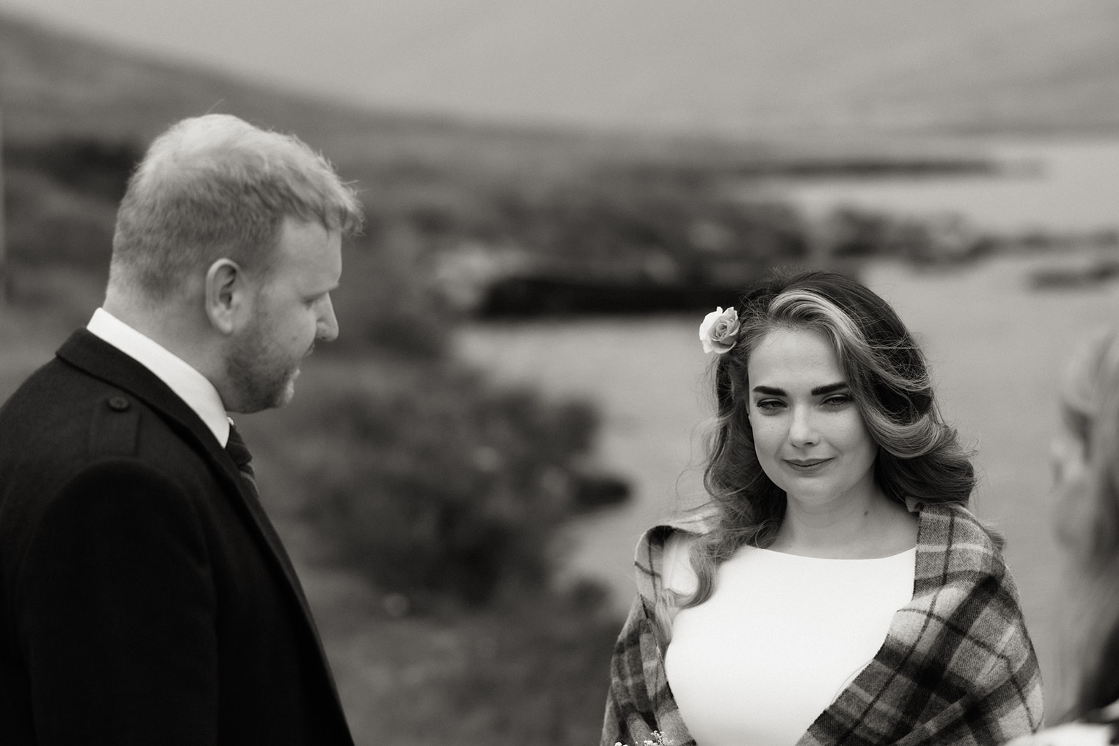 Black and white photograph of bride during her Isle of Arran elopement ceremony outdoors.