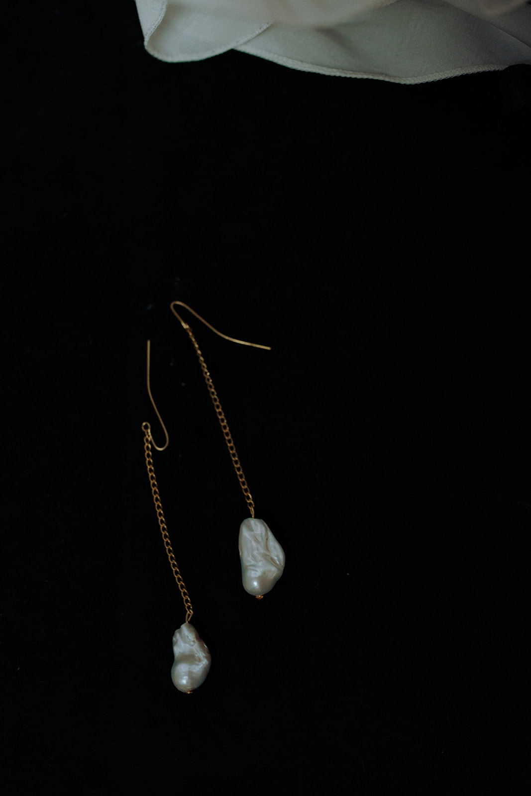 Statement bridal earrings by Lori Muldoon styled against a black backdrop.