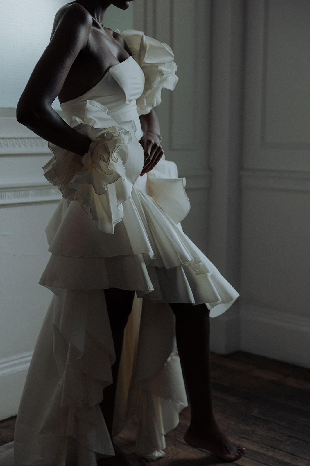 Bride in ruffled Darla Haute Couture gown, editorial wedding fashion photograph.