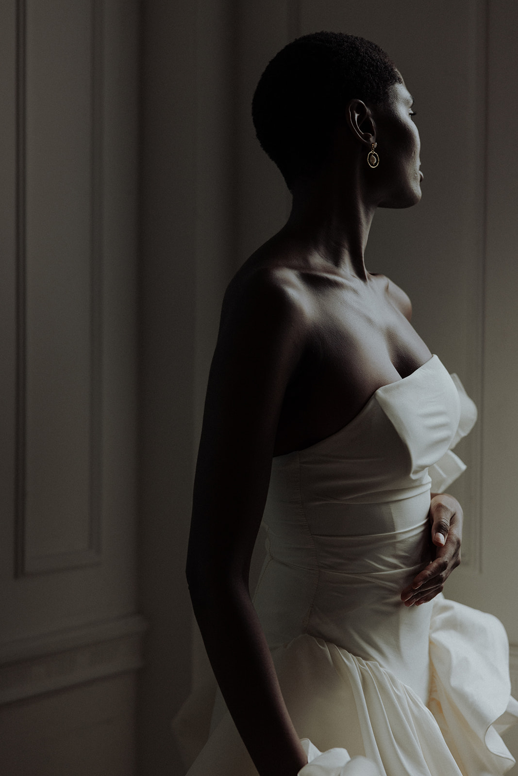 Sculptural ruffled sleeve detail of Darla Haute Couture bridal gown, editorial fashion photograph.